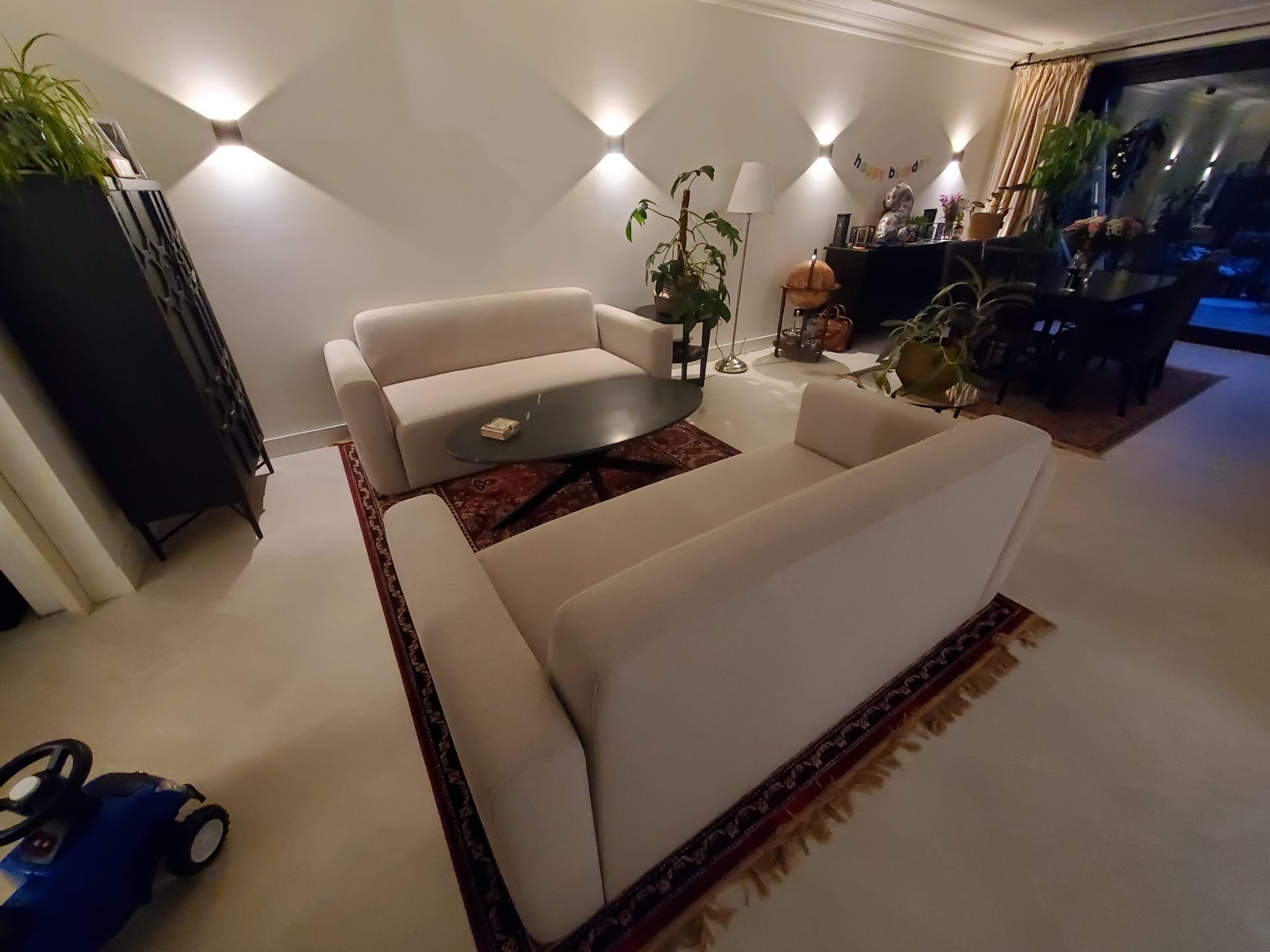 Full interior living room renovation with modern wall lighting in Best